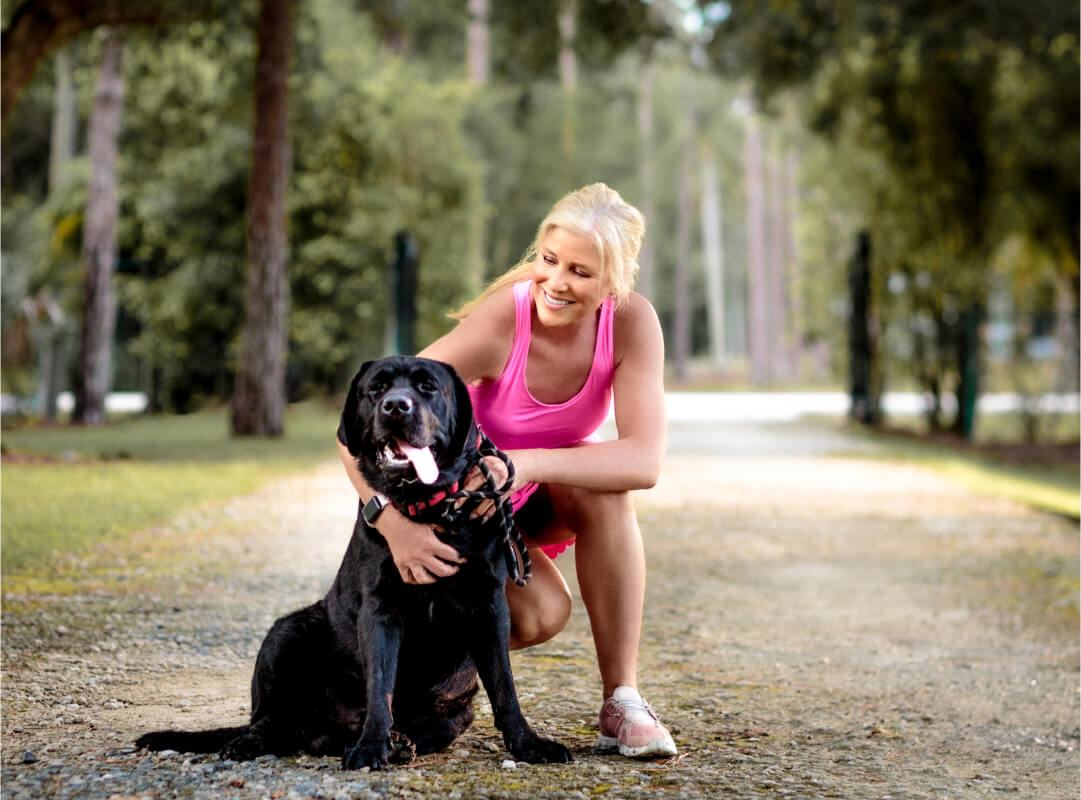 Breast cancer survivor Catherine Haffey exercising with her dog